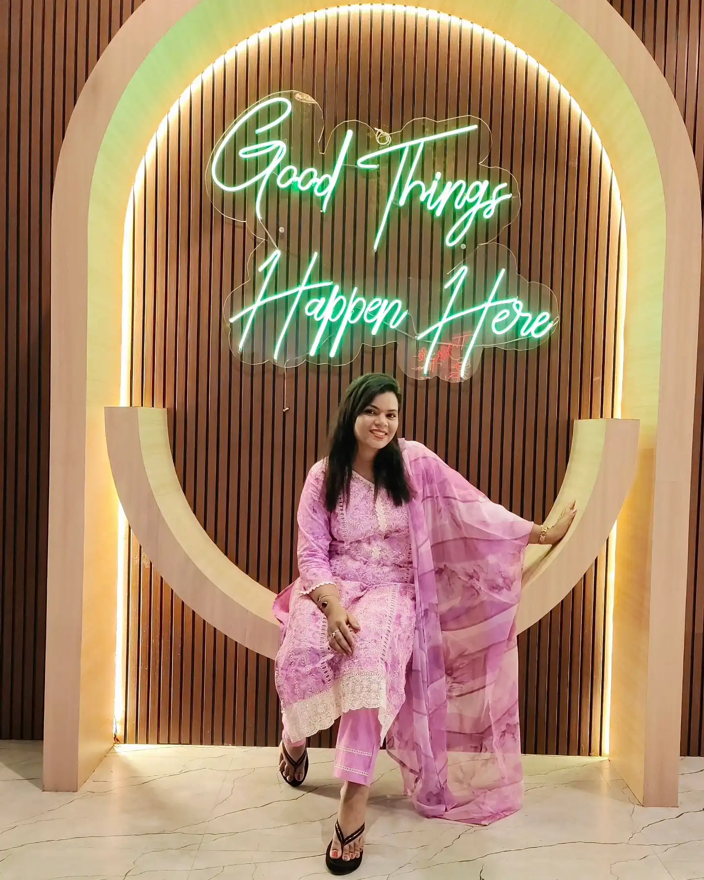 Guest at the Good Things Happen Here neon selfie arch at Shivansh Food Park