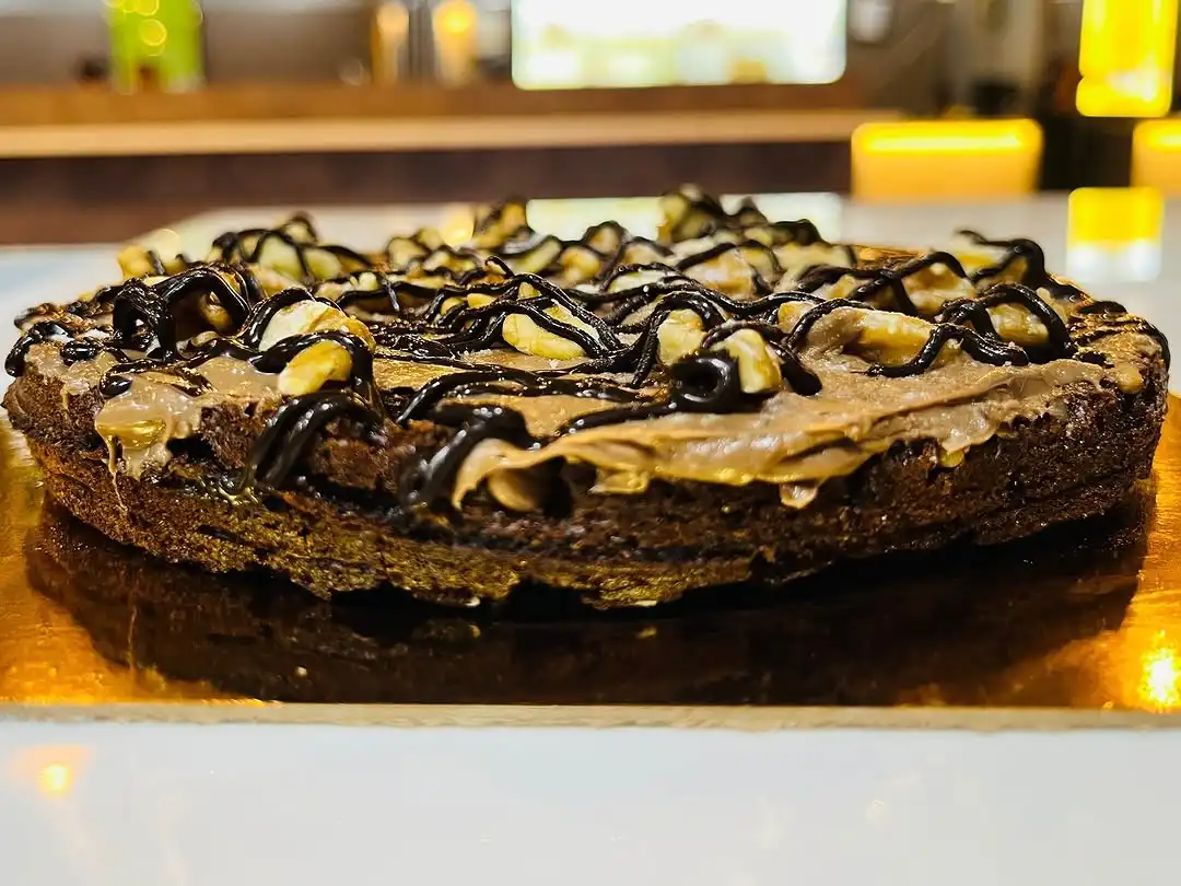 Chocolate walnut brownie drizzled with dark chocolate sauce at Shivansh Food Park
