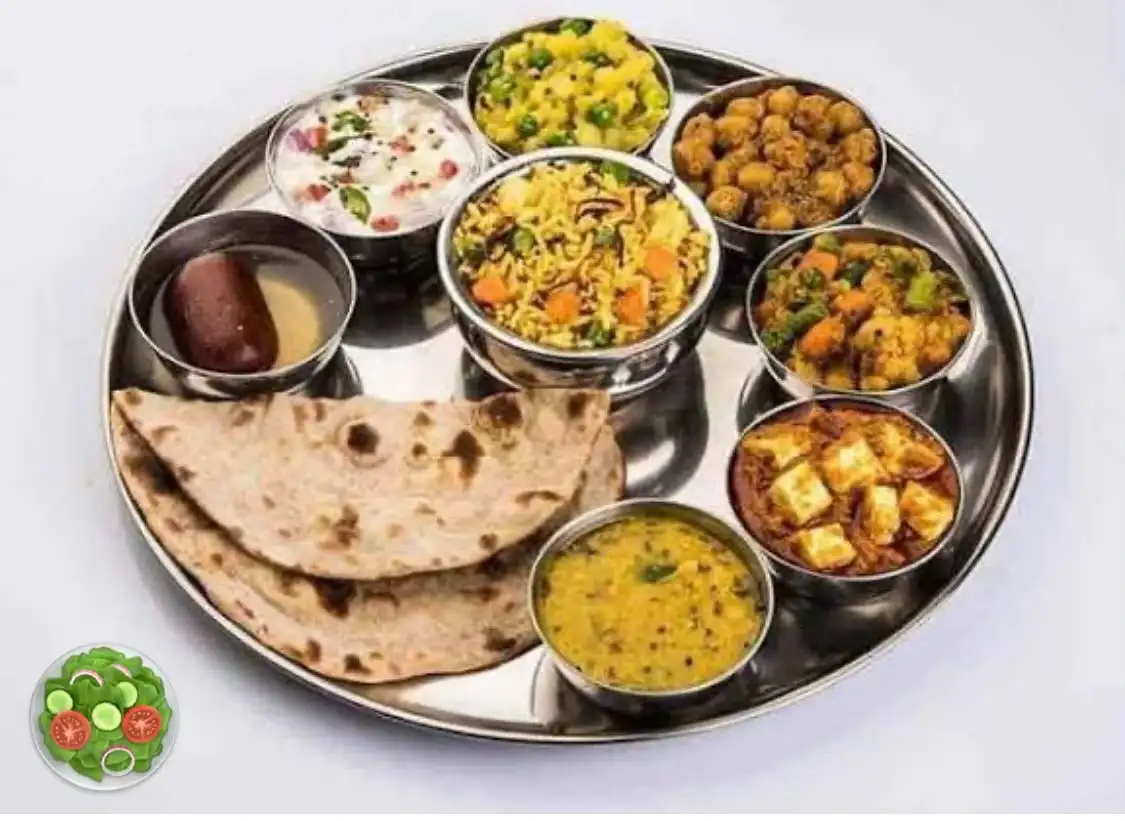Complete vegetarian thali with roti, rice and seven bowls at Shivansh Food Park Dhamtari