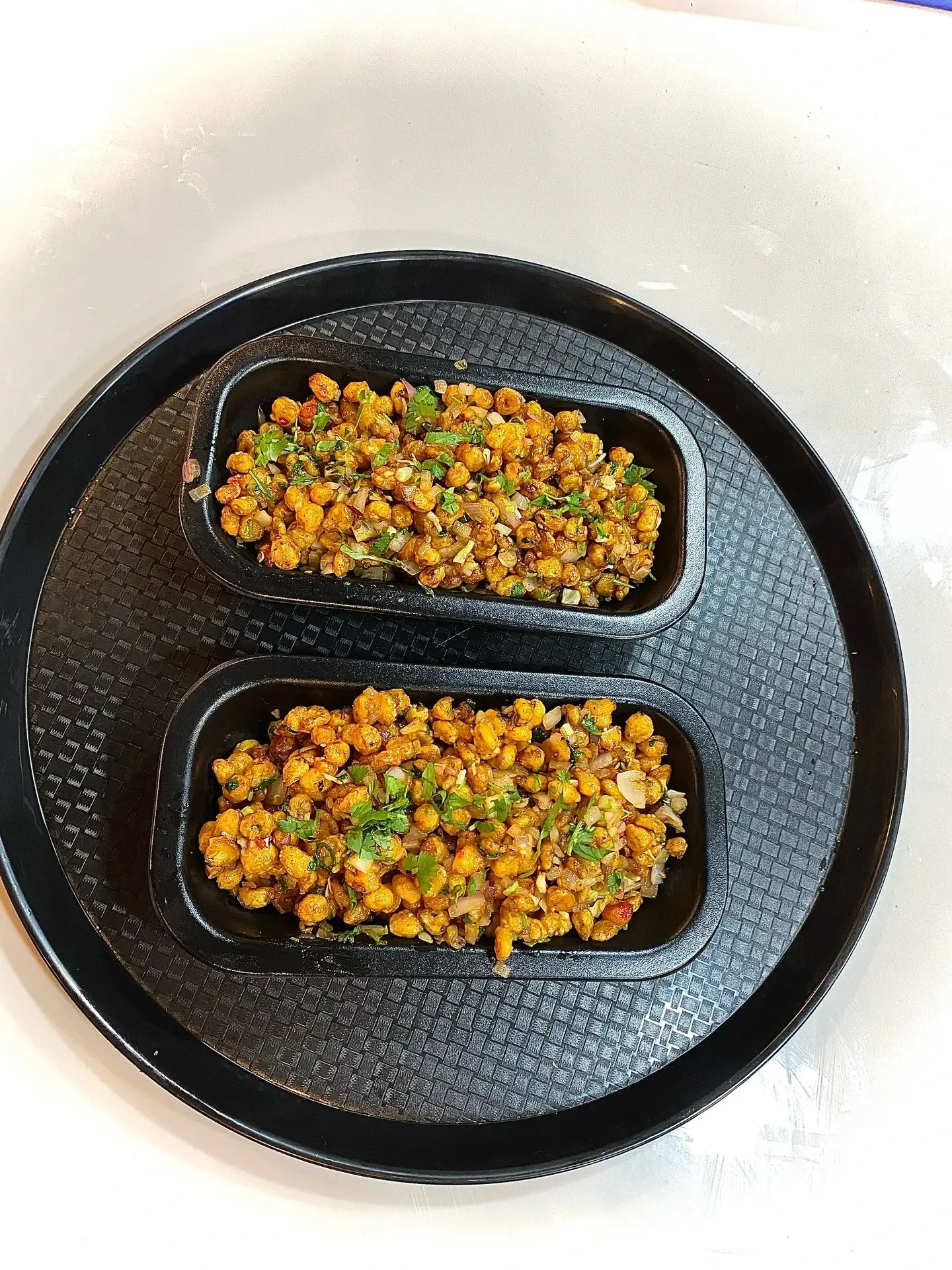 Spiced masala chana snack garnished with coriander at Shivansh Food Park Dhamtari