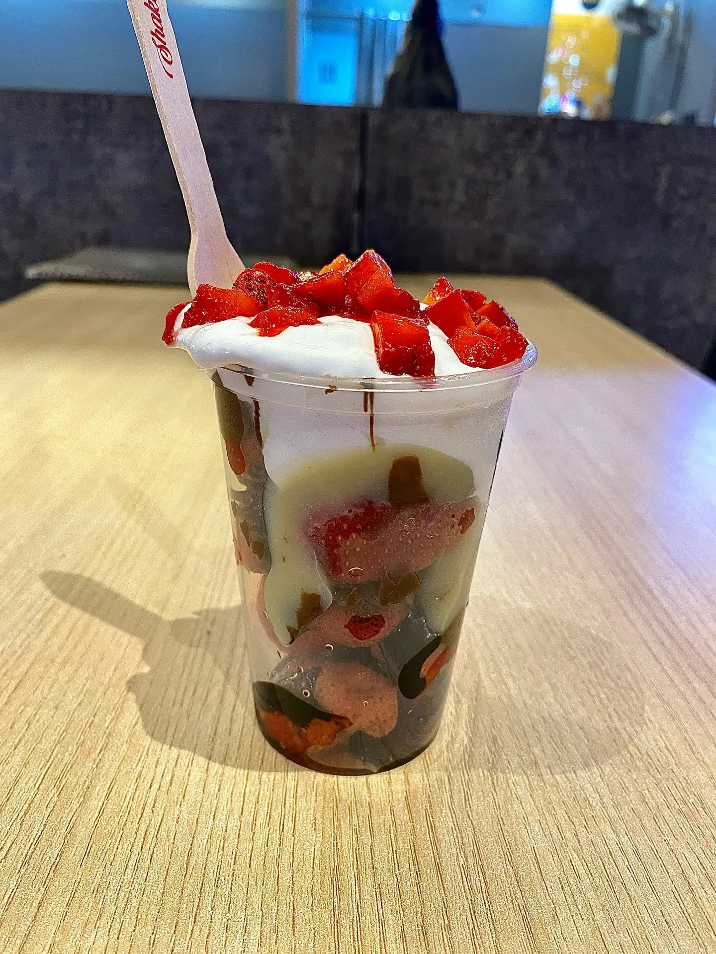 Strawberry ice cream sundae cup topped with fresh strawberries at Shivansh Food Park