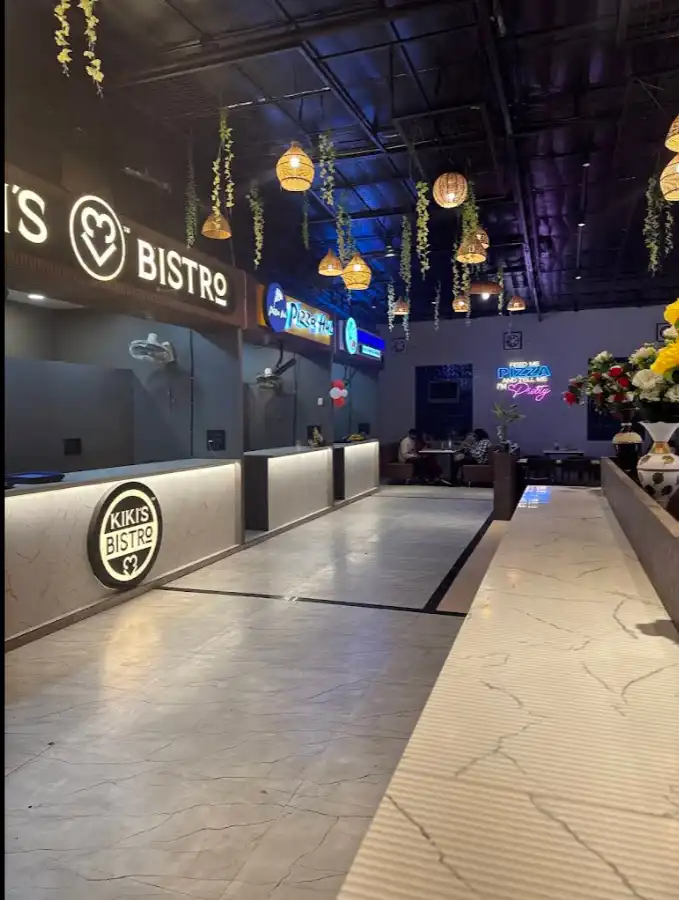Kikis Bistro counter with pendant lights inside Shivansh Food Park